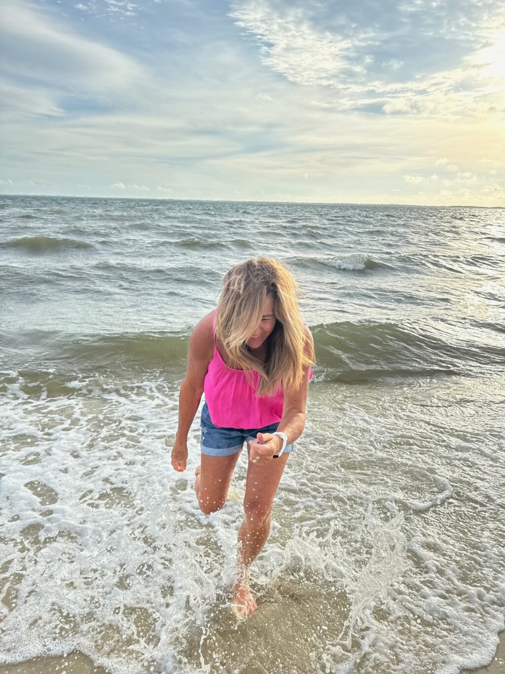 girl laughing in ocean