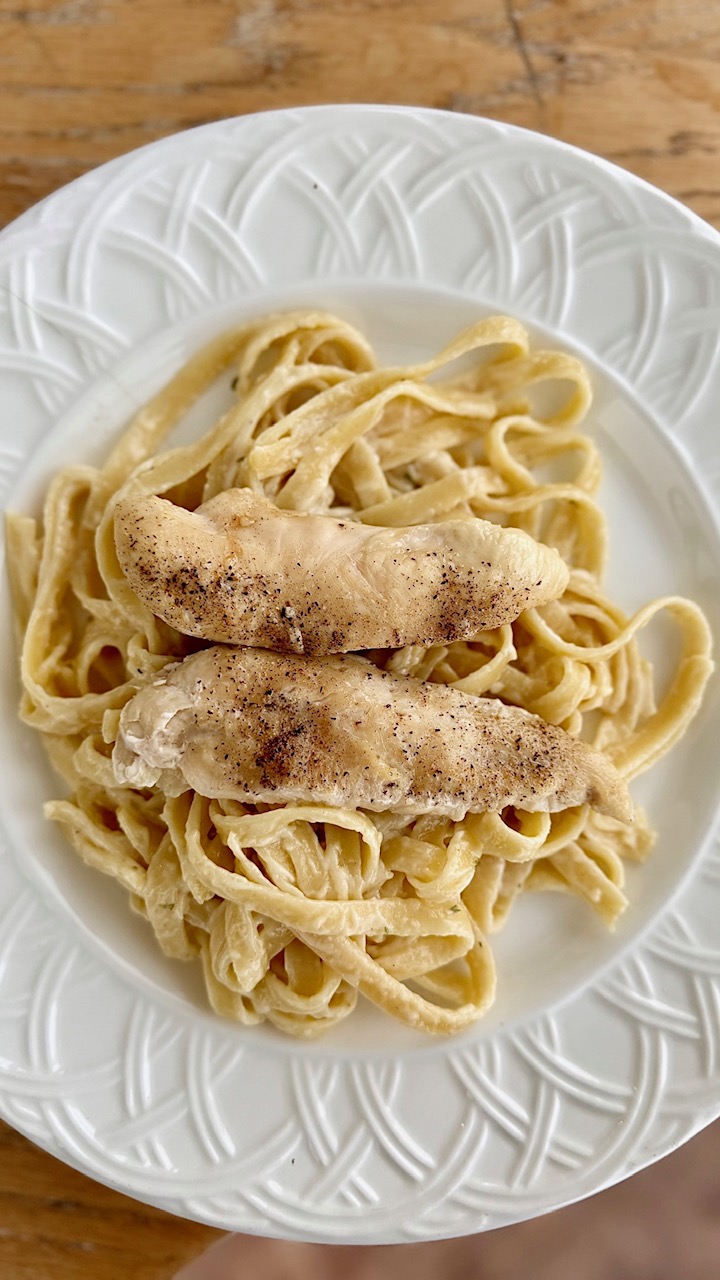 plated fettucine with chicken breasts