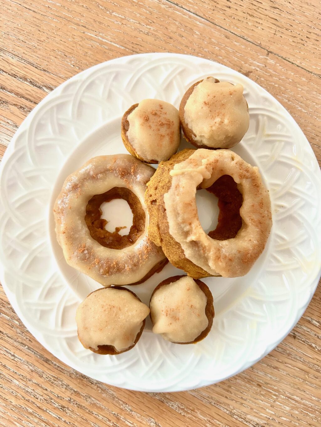 white plate of pumpkin donuts