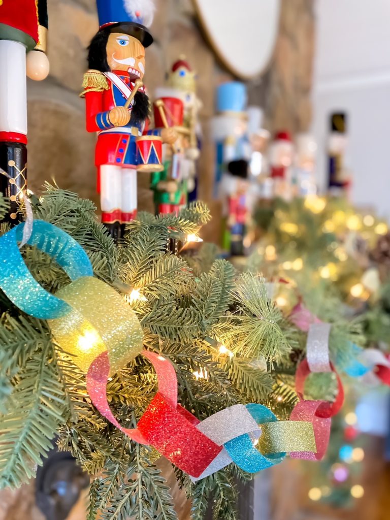 nut crackers and pops of color on christmas mantel