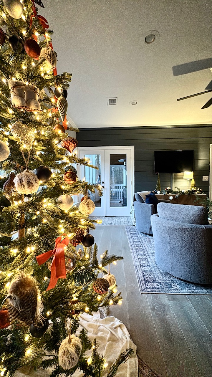 rust ribbons on lighted christmas tree