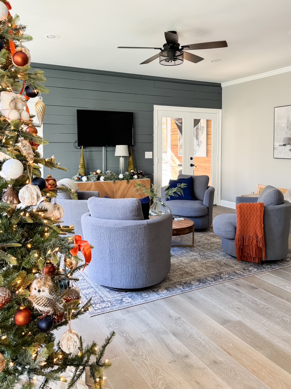 game room with navy and rust holiday decorations