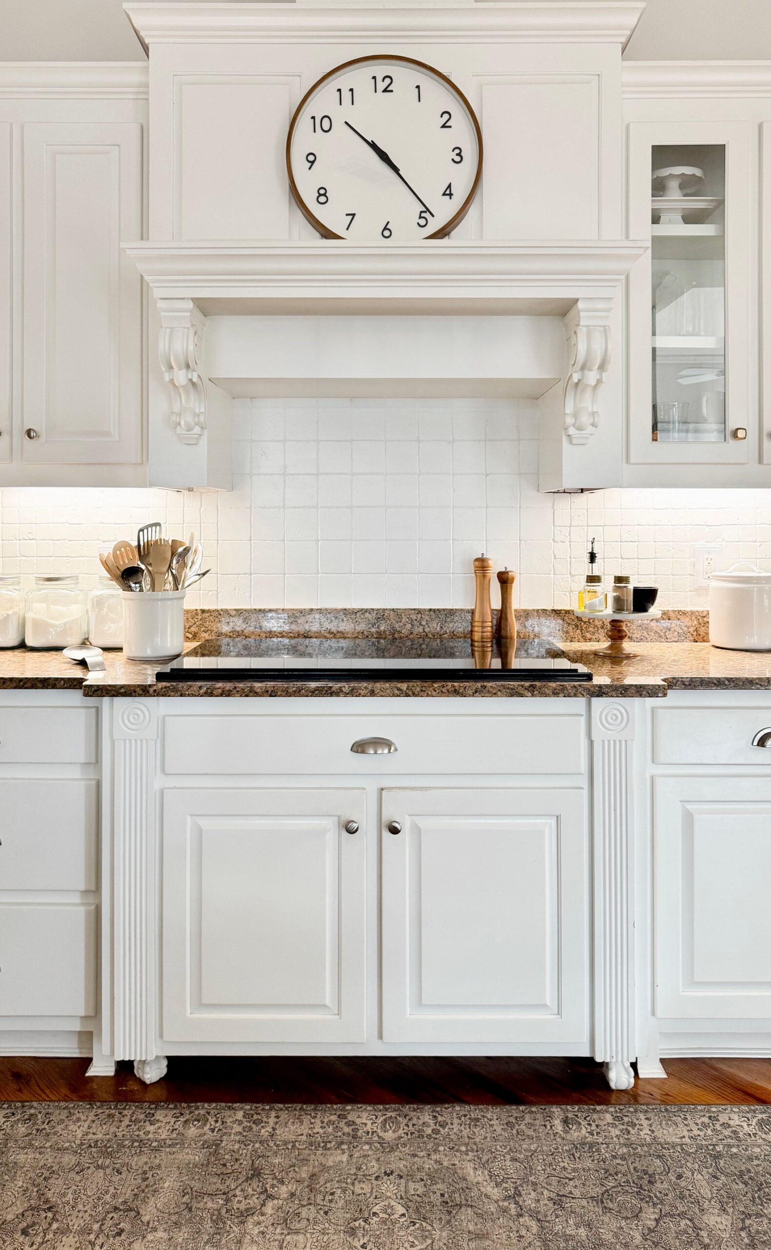 white kitchen with cooktop